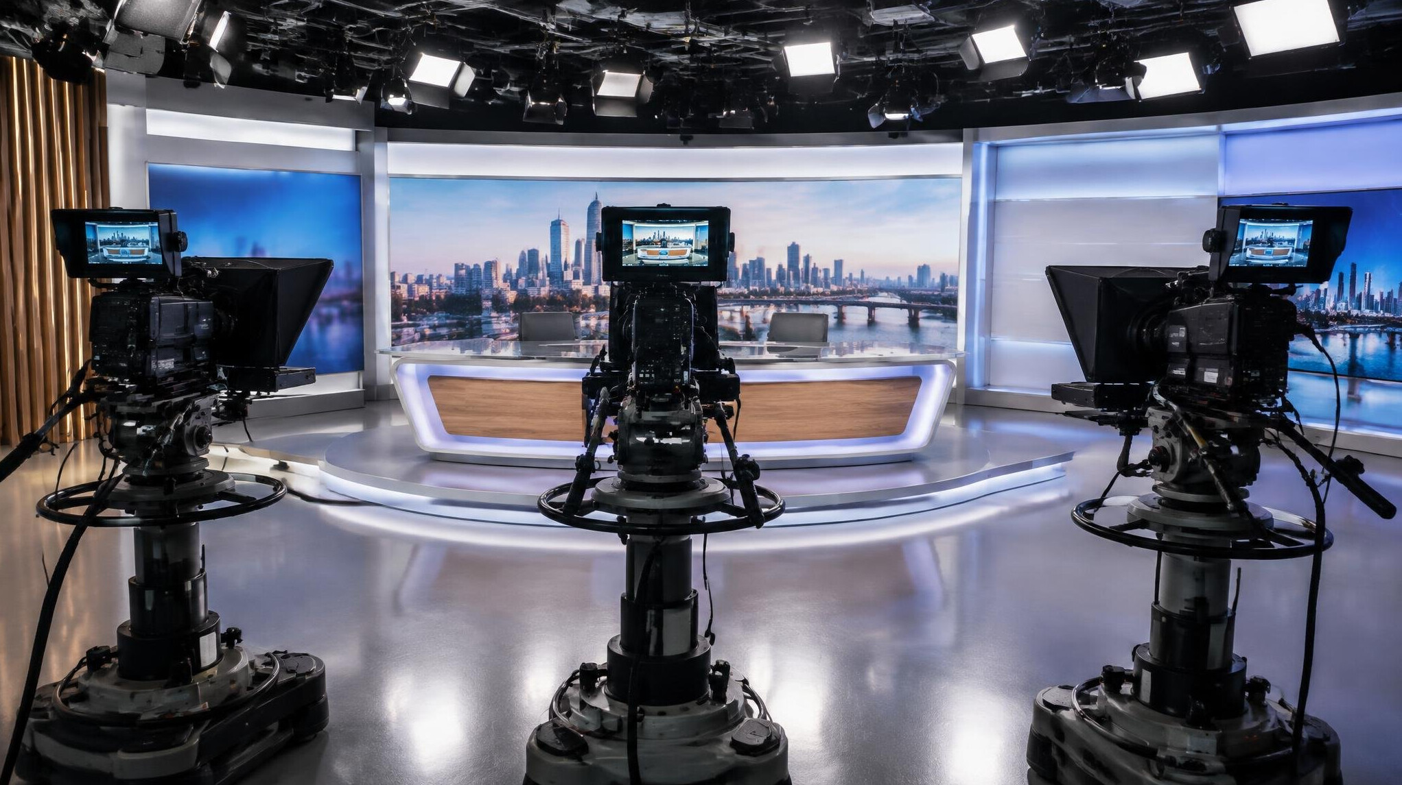 Television studio set with multiple cameras positioned for a live multi-camera production
