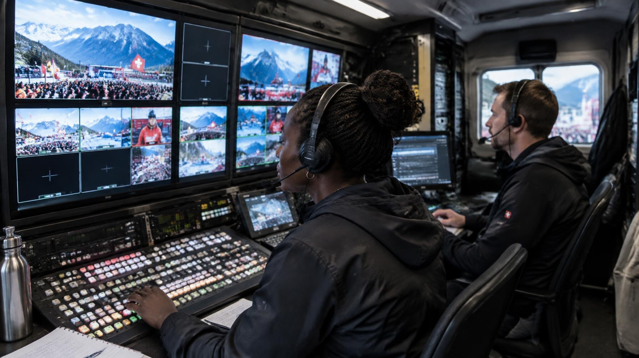Interior of an outside broadcast van with video monitors and mixing equipment